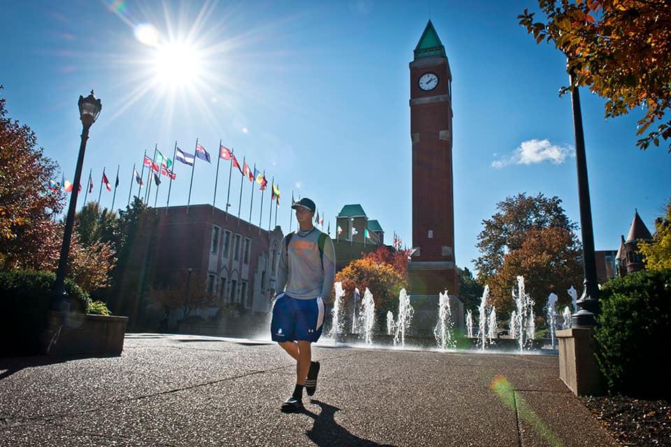 Student walks across campus